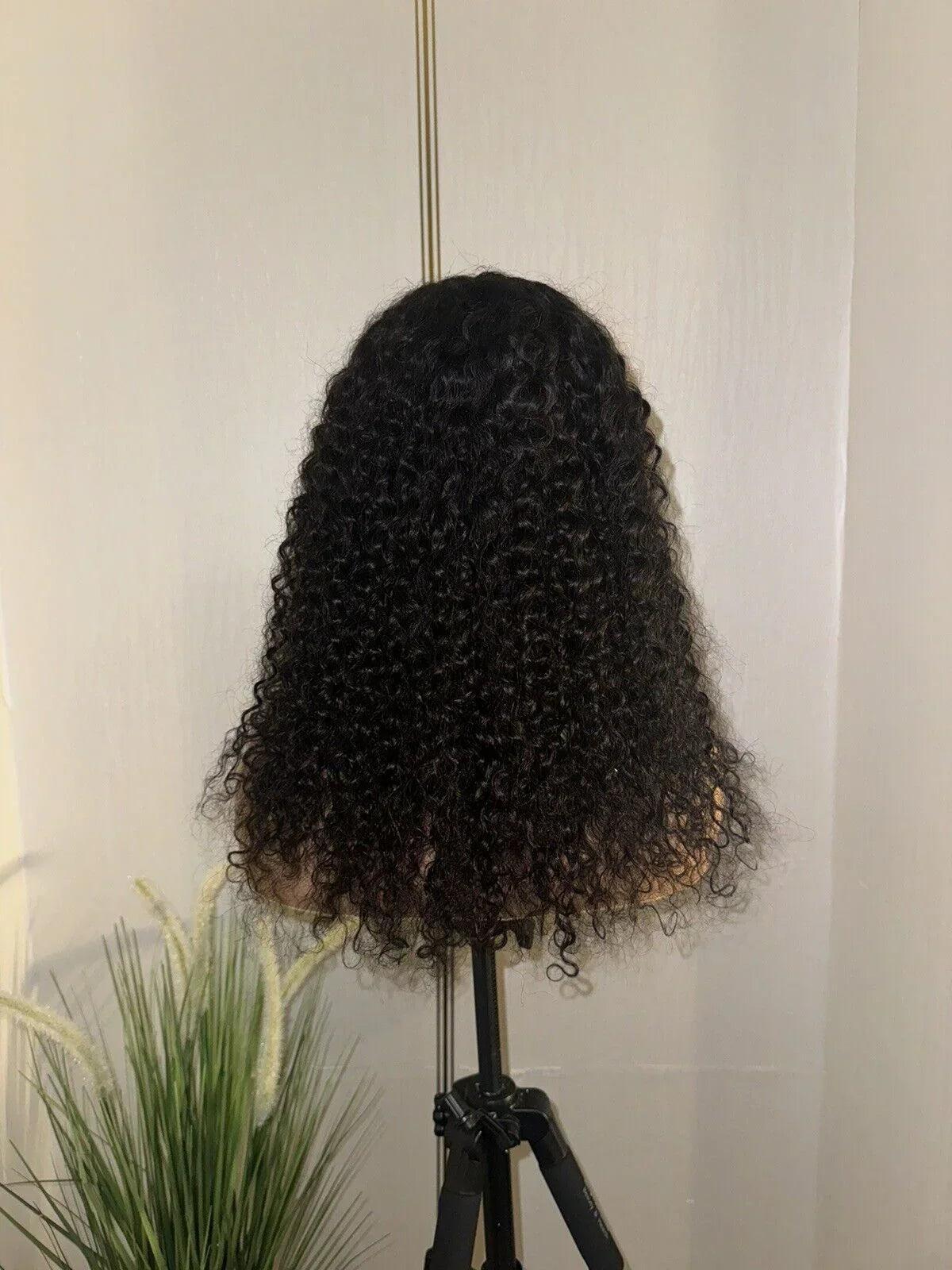 Luxury virgin human hair wig with deep curls, glueless & pre-styled for effortless beauty