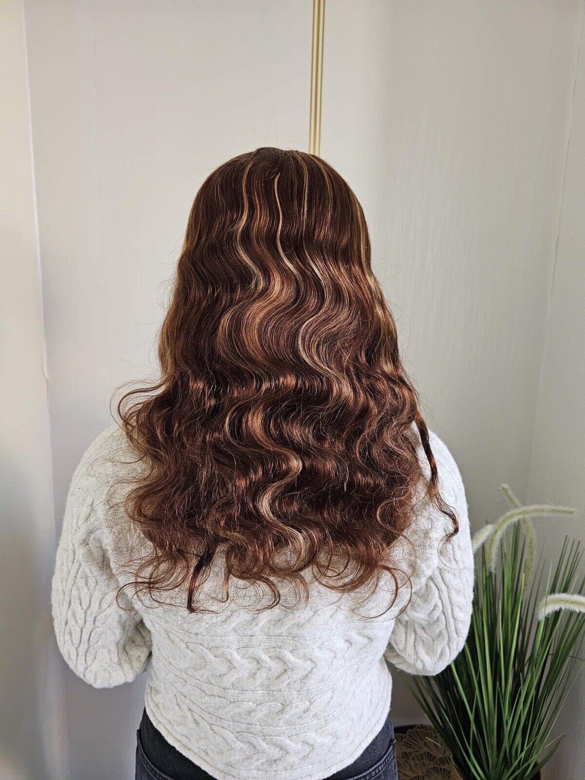 Luxury virgin human hair wig with loose waves and highlights, glueless and pre-styled for effortless beauty.